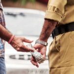 policeman taking bribe