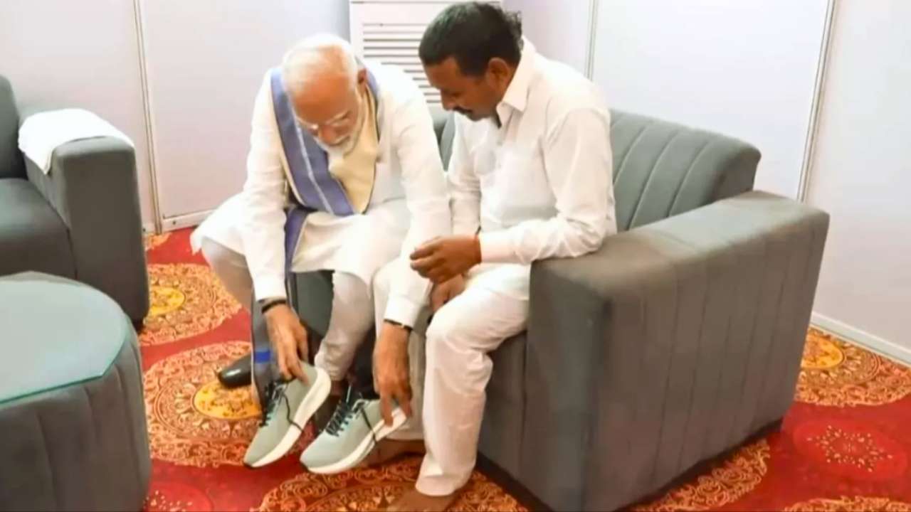 Narendra Modi personally puts on shoes for a devotee during Haryana visit