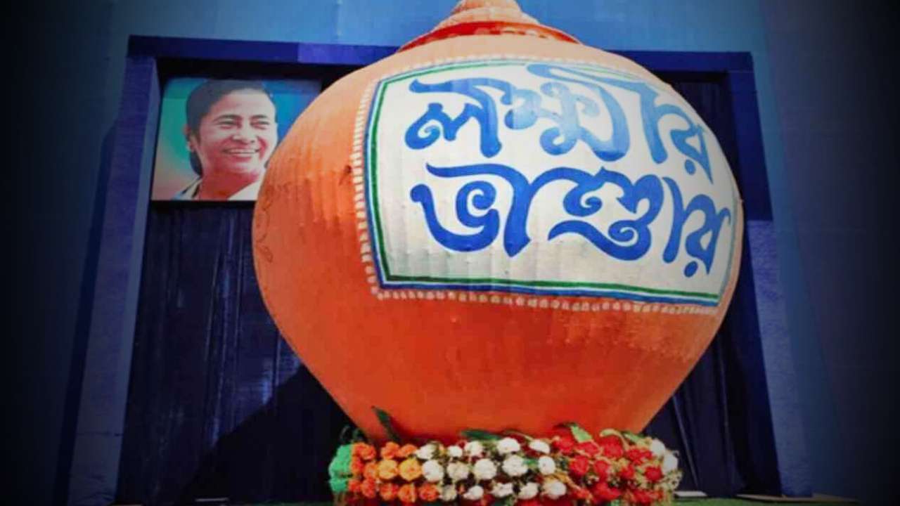 A young man from Malda is receiving money from Lakshmi Bhandar