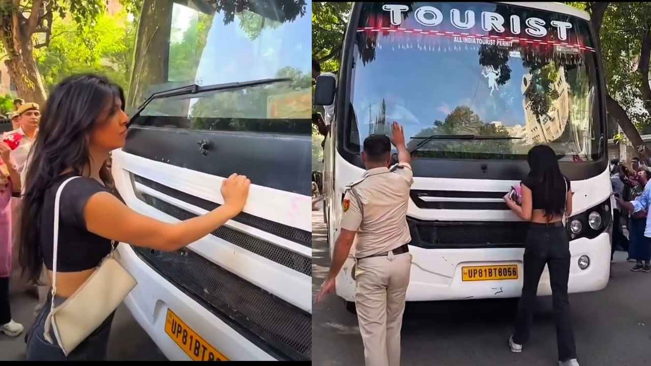 Delhi Protest another young woman blocks police vehicle